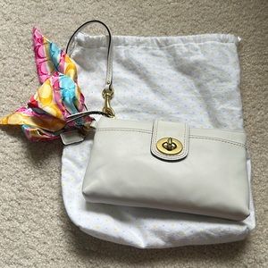 Coach white leather wristlet.